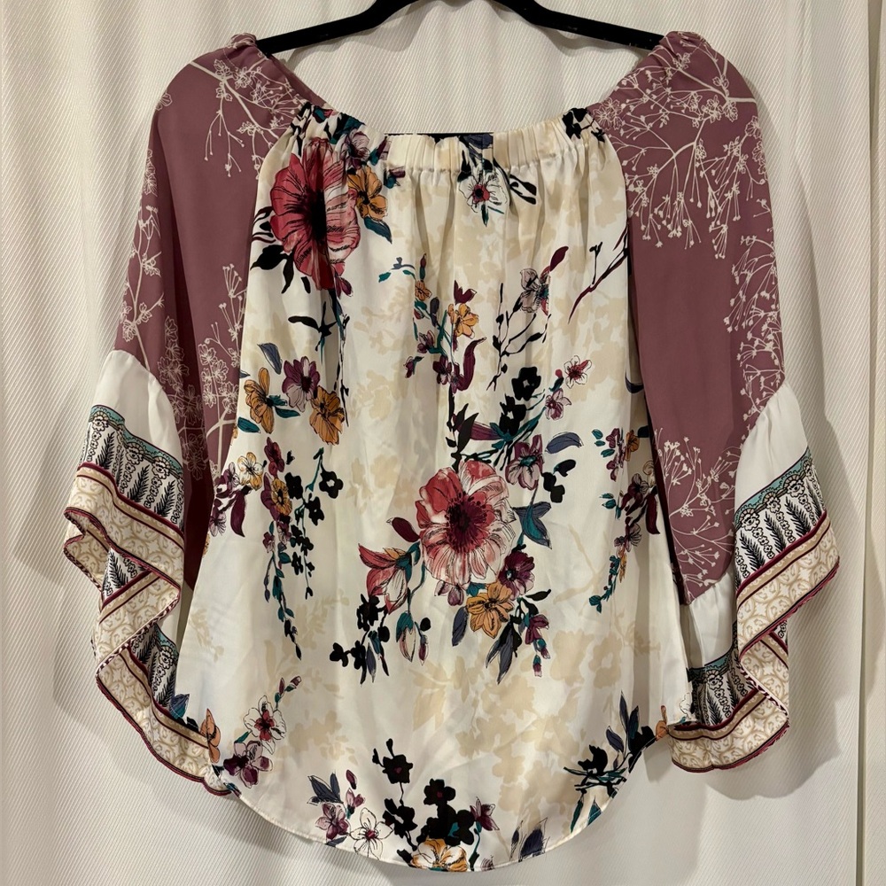 White House Black Market. Adorable multi pattern, off shoulder blouse.